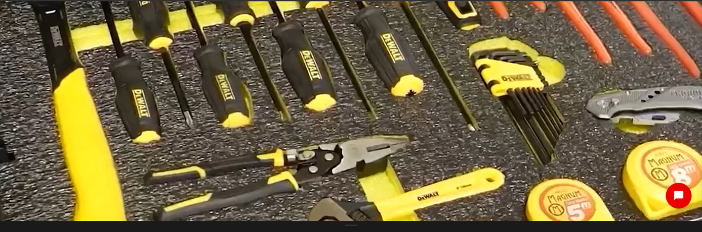 Spanners, pliers and a tape measure seated in a Shadow Foam toolbox insert